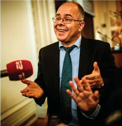  ??  ?? Speakingou­t: Howard Wilkinson, a former employee of the Estonian unit of Danske Bank, gestures as he talks to reporters at a parliament­ary hearing in Copenhagen, Denmark