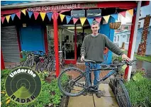  ?? PHOTO: MURRAY WILSON/STUFF ?? Green Bikes general manager Peter Cooke likes giving old bicycles a new lease of life.