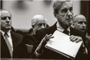  ?? Salwan Georges / Washington Post ?? Special counsel Robert Mueller is seen meeting with the House Judiciary Committee last July. In his report, Mueller neither exonerated nor accused President Donald Trump of obstructin­g justice.