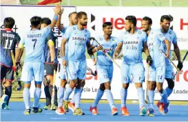  ??  ?? Indian players celebrate a goal against Japan in a Pool A match of the Asia Cup hockey tournament on Wednesday