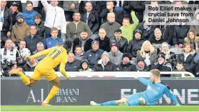  ??  ?? Rob Elliot makes a crucial save from Daniel Johnson