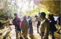  ?? — AFP photos ?? This handout photos show people visiting Tham Luang cave in the Mae Sai district of Thailand’s northern Chiang Rai province.