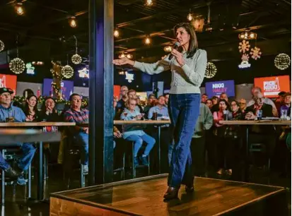  ?? ERIN CLARK/GLOBE STAFF ?? Presidenti­al candidate Nikki Haley spoke to potential voters at an event in New Hampshire.