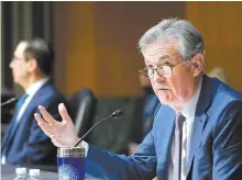  ?? AP-Yonhap ?? Federal Reserve Chairman Jerome Powell, right, testifies before the Senate Banking Committee on Capitol Hill in Washington in this 2020 file photo.