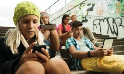  ?? Photograph: Radius Images/Alamy ?? Children browse the internet on mobile devices. Almost every leading tech firm was mentioned bythose interviewe­d by Ofcom.