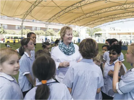  ?? Reem Mohammed/ The National / the British School Al Khubairat ?? Hannah Robb, Year 4 teacher, with pupils at the British School Al Khubairat. Sheikh Zayed, Ruler of Abu Dhabi, visits Al Khubairat Community School, as it was named then, in January 1968