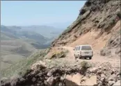  ?? PICTURE: FEROZE EBRAHIM ?? HEADING HOME: A minibus taxi negotiates the curves on Sani Pass; the gateway to the kingdom of Lesotho.