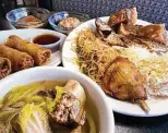  ??  ?? Susie’s Lumpia House buffet includes, clockwise from front, beef-shank soup, fried lumpia, leche flan, rice pudding, lechon kawali, scrod, pancit and pork adobo.