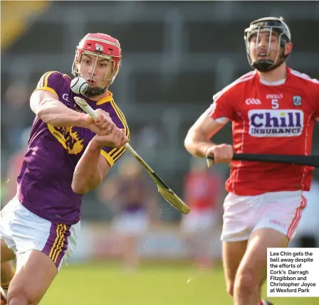  ??  ?? Lee Chin gets the ball away despite the efforts of Cork’s Darragh Fitzgibbon and Christophe­r Joyce at Wexford Park