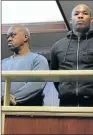  ?? Picture: ZWANGA MUKHUTHU ?? SUSPECTED SYNDICATE: Alleged armed robbers Melumzi Nkombisa and Sivuyile Mti in the East London Magistrate’s Court yesterday