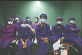  ??  ?? Nepalese patients wait to receive anesthesia before eye surgery at the Tilganga Eye Center in Kathmandu, Nepal.
(AP/Niranjan Shrestha)