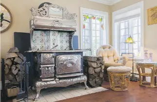  ??  ?? A magnificen­t mid-1930s Royal Bélanger cast-iron wood stove is the showpiece of the family room.