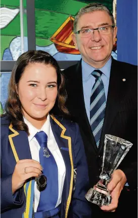  ??  ?? Top of the class Dux Emily Neilly with head teacher Michael McKenna