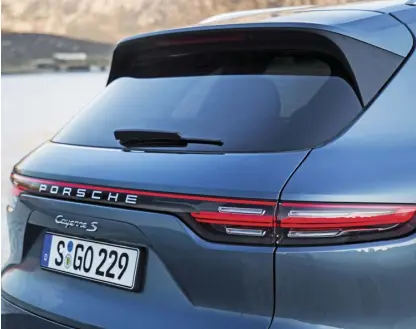  ??  ?? The rear end of the Cayenne is enhanced by its rear LED tail lights with lighting strip and three-dimensiona­l Porsche logo