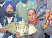  ?? SAMEER SEHGAL/HT ?? Balbir Kaur (right), sister of victim Kuldeep Kaur, and SAD leader Ravi Karan Kahlon showing medals bagged by the karate player at a press conference in Amritsar on Friday.
