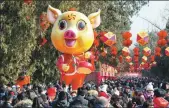  ?? SU YANG / FOR CHINA DAILY ?? A crowd celebrates the Lunar New Year at a fair in Beijing on Friday.