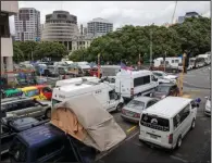  ?? (AP/New Zealand Herald/Mark Mitchell) ?? Vehicles of protesters against vaccine mandates are parked Monday on the streets near Parliament in Wellington, New Zealand.