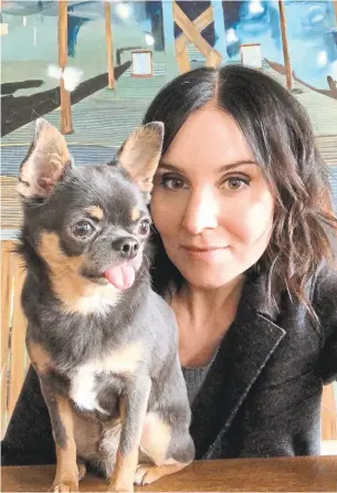  ?? HEATHER STEEDE ?? Dr. Heather Steede, with one of her two pups, is a veterinari­an at the Downtown Animal Hospital. “It’s a vet’s responsibi­lity to recognize stress symptoms,” she says.