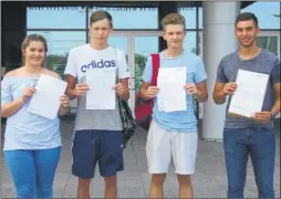  ??  ?? Megan Parrott, Scott Fox, Aaron Biggs and Bobby Liston collect their results at New Line Learning Academy