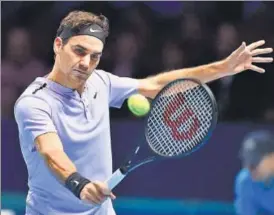  ?? AFP ?? Roger Federer on way to beating Alexander Zverev in an ATP World Tour Finals match on Tuesday.