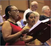  ??  ?? HIGH NOTES: Sopranos Dudu Sokhela and Yolanda Samson in one of the final rehearsals.