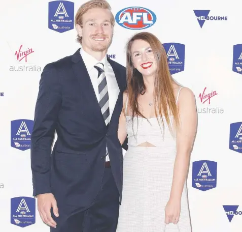  ?? Picture: DANIEL POCKETT/AAP ?? CHOSEN: Geelong’s Tom Stewart and partner Hannah Davis arrive at last night’s AFL All-Australian Awards