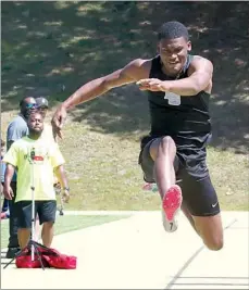  ?? The Sentinel-Record/Richard Rasmussen ?? ■ Hot Springs’ Tyrell Lambert competes in the triple jump at the Class 5A state track meet at Hot Springs Thursday. Lambert won the event with a jump of 46 feet, 3 inches.