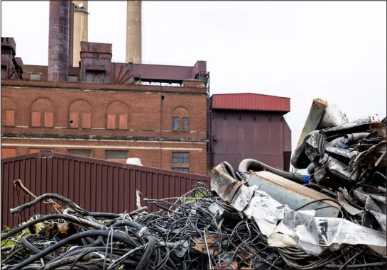  ?? DANIEL LOZADA — THE NEW YORK TIMES ?? Debris piles up during demolition work Sept. 27 at a former coal-fired power plant, which the Cleveland Electric Illuminati­ng Co. opened in 1926 and shut down in 2022, on the shores of Lake Erie in Avon Lake, Ohio.