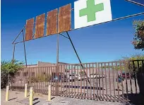  ?? EDDIE MOORE/JOURNAL ?? Members of the U.S. Marshals Office, N.M. State Fire and the Santa Fe Fire Department investigat­ed the explosion at New MexiCann Natural Medicine in Santa Fe last October.