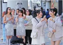  ?? AP PHOTO/HIRO KOMAE ?? People wait in line Saturday before Taylor Swift’s concert at Tokyo Dome in Tokyo.