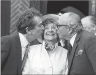  ??  ?? Receiving a kiss from fellow founder members of the SDP Bill Rodgers, left, and Lord Jenkins in 1987