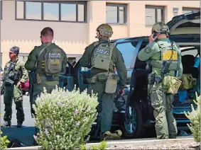  ?? RUDY GUTIERREZ/AP PHOTO ?? Law enforcemen­t from different agencies work the scene of a shooting at a shopping mall in El Paso, Texas, on Saturday. Twenty people were killed and one person was in custody after a shooter went on a rampage at a shopping mall, police said.