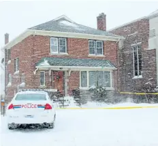  ?? ALLAN BENNER/STANDARD STAFF ?? A Niagara Regional Police cruiser is parked at a Lake Street home in St. Catharines wrapped in yellow police caution tape Tuesday, after a woman was shot during a home invasion Monday evening.