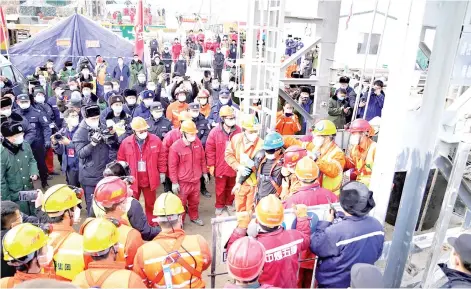  ?? — AFP photo ?? One of the 11 miners who were brought to the surface on Sunday from hundreds of metres undergroun­d where they had been trapped for two weeks.