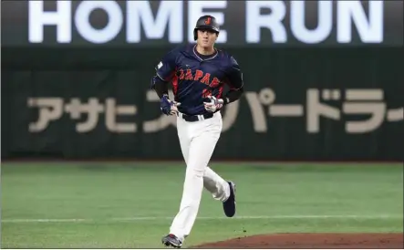  ?? EUGENE HOSHIKO – THE ASSOCIATED PRESS ?? Shohei Ohtani of Japan rounds the bases after hitting a three-run home run against Australia in a World Baseball Classic game at Tokyo.