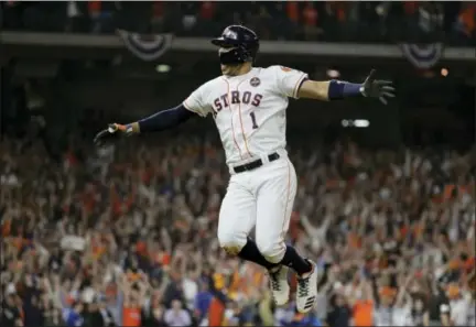  ?? DAVID J. PHILLIP — THE ASSOCIATED PRESS ?? Astros’ Carlos Correa celebrates his two-run home run during World Series Game 5 victory over Dodgers Sunday in Houston.