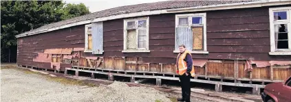  ?? PHOTOS: SUPPLIED ?? To be removed . . . Gore District Council facilities administra­tion officer Neil Mair outside one of the old school buildings that will be demolished. Graffiti from 1944 has been found in one of the buildings.