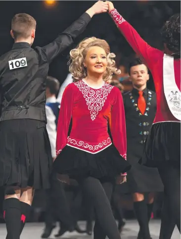  ?? Picture: STEWART McLEAN ?? BUSTING A MOVE: Sinead Doherty, from Melbourne, dances in the under-18s section at the Australian Irish Dancing Championsh­ips at Cairns Convention Centre.