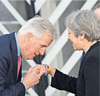  ??  ?? Michel Barnier, the EU’s chief Brexit negotiator, kisses Theresa May’s hand – yet it was recently reported that he had said his job was to make the deal ‘so hard on the British that they’ll end up preferring to stay’