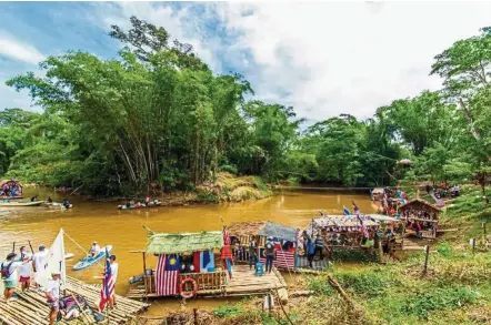  ??  ?? Some of the decorated bamboo rafts seen at Pesta Rakit 2016 in Penampang, Sabah. — CLEAR