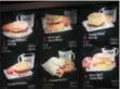  ?? MARK LENNIHAN — THE ASSOCIATED PRESS FILE ?? In this file photo, items on the breakfast menu, including the calories, are posted at a McDonald’s restaurant in New York. Restaurant and grocery chains scrambling to post calorie counts on their menus by spring have been peppering the Food and Drug...