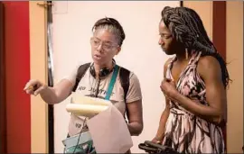  ?? Patti Perret Warner Bros. Enter t ai nment ?? DeMANE DAVIS, left, directs actress Rutina Wesley in an episode of the Louisiana- set television series “Queen Sugar,” created by f ilmmaker Ava DuVernay.