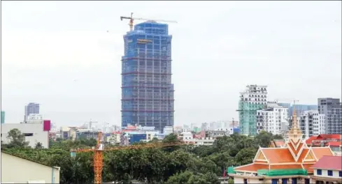  ?? PHA LINA ?? A penthouse under constructi­on in the Kingdom’s capital. CBRE Cambodia said 218 condominiu­m units were added during the last quarter.