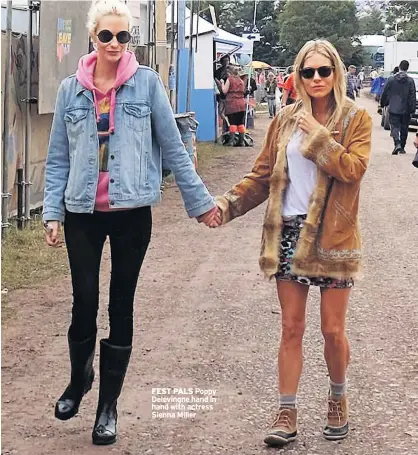  ??  ?? FEST PALS
Poppy Delevingne hand in hand with actress Sienna Miller