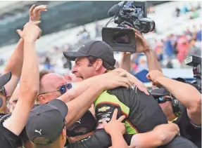  ?? THOMAS J. RUSSO/USA TODAY SPORTS ?? Simon Pagenaud of France is congratula­ted by a member of his crew Sunday after he earned the pole for the Indianapol­is 500.