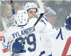  ?? GRAHAM HUGHES/THE CANADIAN PRESS ?? Maple Leafs teammates Auston Matthews and William Nylander celebrate a goal earlier this month.
