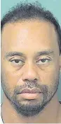  ??  ?? Rough times: Tiger Woods’ arrest (above) by Florida Police was his lowest ebb, a far cry from when (top) he received the green jacket from Nick Faldo after winning the Masters at Augusta in 1997