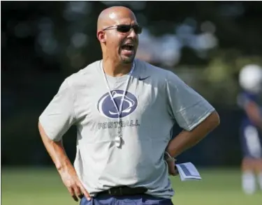  ?? GENE J. PUSKAR — THE ASSOCIATED PRESS FILE ?? Penn State head coach James Franklin gives instructio­n during the team’s practice in State College, Pa. As college football season approaches teams all over the country are choosing captains, those hard-working, high-character players who set an...