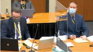  ?? The Associated Press ?? ■ In this image from video, defense attorney Eric Nelson, left, and former Minneapoli­s police officer Derek Chauvin, right, listen as Assistant Minnesota Attorney General Matthew Frank, questions witness Donald Williams, as Hennepin County Judge Peter Cahill presides Tuesday at the Hennepin County Courthouse in Minneapoli­s, Minn. Chauvin is charged in the May 25, 2020, death of George Floyd.