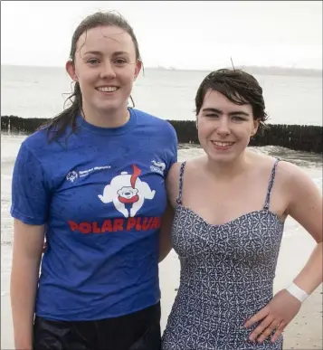  ??  ?? Aoife Burke and Kayla Byrne taking part in the Polar Plunge in Rosslare.